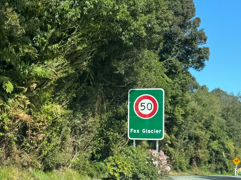Arrival sign at Fox Glacier township